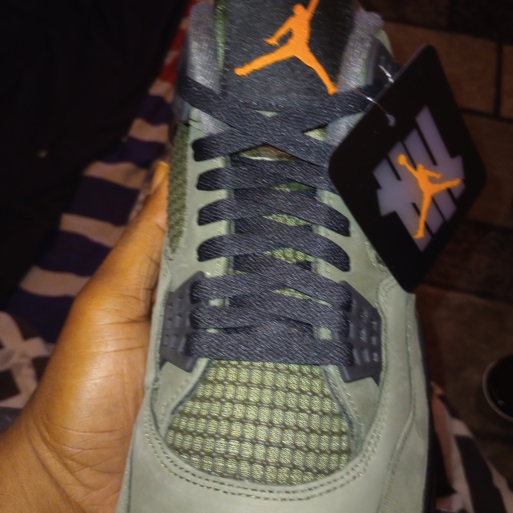 Undefeated Sneakers with Orange and Black Accents